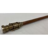 A reproduction wood and brass walking stick with swivel top telescope/compass handle. Approx. 96c…