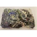 A sealed bag of mixed modern costume jewellery to include faux pearl bracelets and beaded necklac…