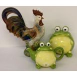A large painted ceramic cockerel figurine together with a modern ceramic biscuit barrel and teapo…
