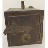 A vintage copper steriliser with opening front door. Approx. 15cm square. …