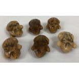 6 small carved netsukes in the shape of toads, each carved top & bottom with a hole running throu…