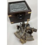 A replica wooden and glass lidded box containing a "Victorian Travelling Sextant" by Smith & Co. …
