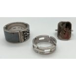 3 silver rings. A man's band ring with hematite panel, a chain style band ring and a dress ring with