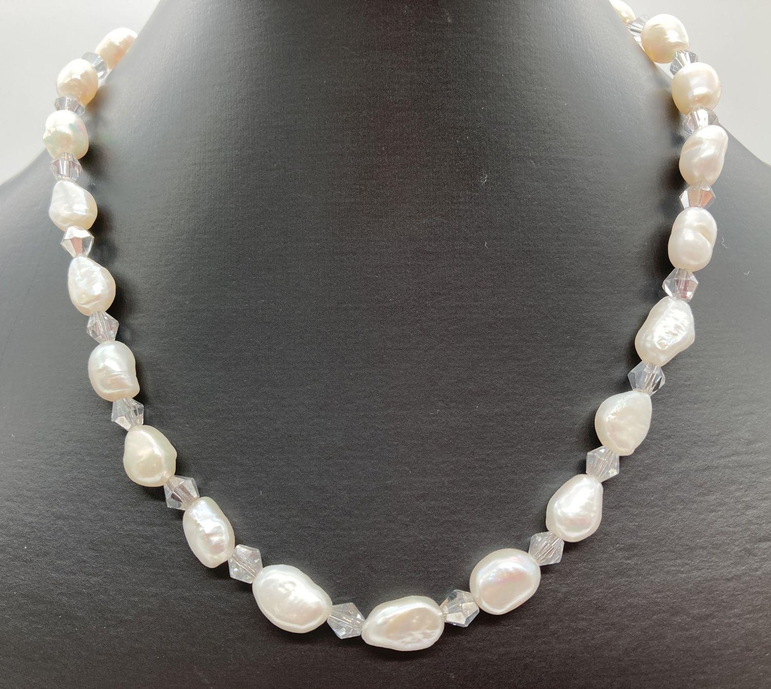 A 16" alternate freshwater pearl and grey crystal bead necklace with white metal T bar clasp. Ex