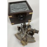 A replica wooden and glass lidded box containing a "Victorian Travelling Sextant" by Smith & Co.