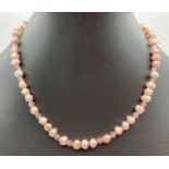 A 16" pink freshwater pearl and faceted glass bead necklace with magnetic barrel clasp. Ex jewellery