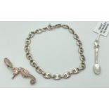 A mariners link silver bracelet together with a seahorse charm and a spoon charm, both with