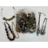 A collection of 40 plus vintage and modern necklaces and pendants to include statement pieces.