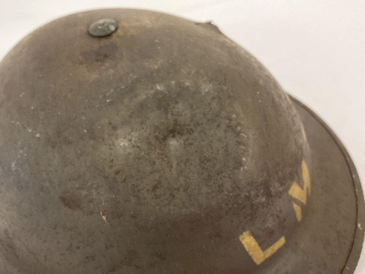 British MkII steel helmet painted khaki with stencilled 'LMS' (London Midland Scottish Railway). - Image 2 of 7