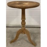 A vintage pine circular topped tripod legged occassional table. Approx. 57.5cm tall x 36.5cm