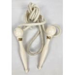 A vintage wooden handled "Flexten" ball bearing skipping rope. Rope length approx. 10".