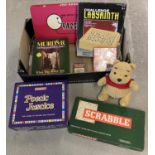 A box of assorted toys. To include: musical Winnie-The-Pooh soft toy, Wooden Challenge Labyrinth,