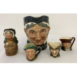 A collection of Royal Doulton ceramic toby jugs, in varying sizes.