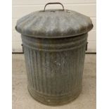 A vintage galvanised metal dustbin with lid and carry handles.