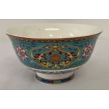 A decorative Chinese porcelain poke bowl with floral design to outer bowl.