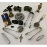 A collection of assorted misc items to include sugar tongs, penknives & Dinky Toys military vehicles