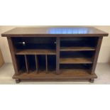 A solid wood medium oak multi sectional storage/lounge unit.