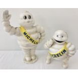 2 painted cast iron Money banks in the shape of the Michelin Man.