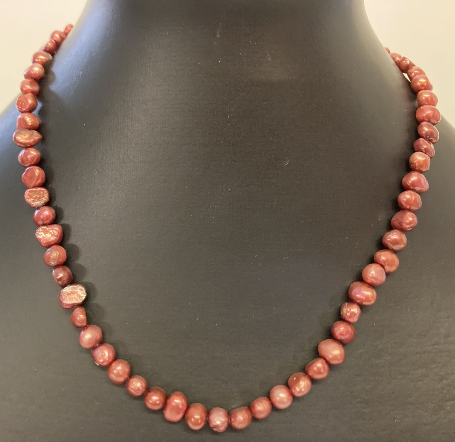 A 15" dyed freshwater pearl necklace with silver tone magnetic barrel clasp.