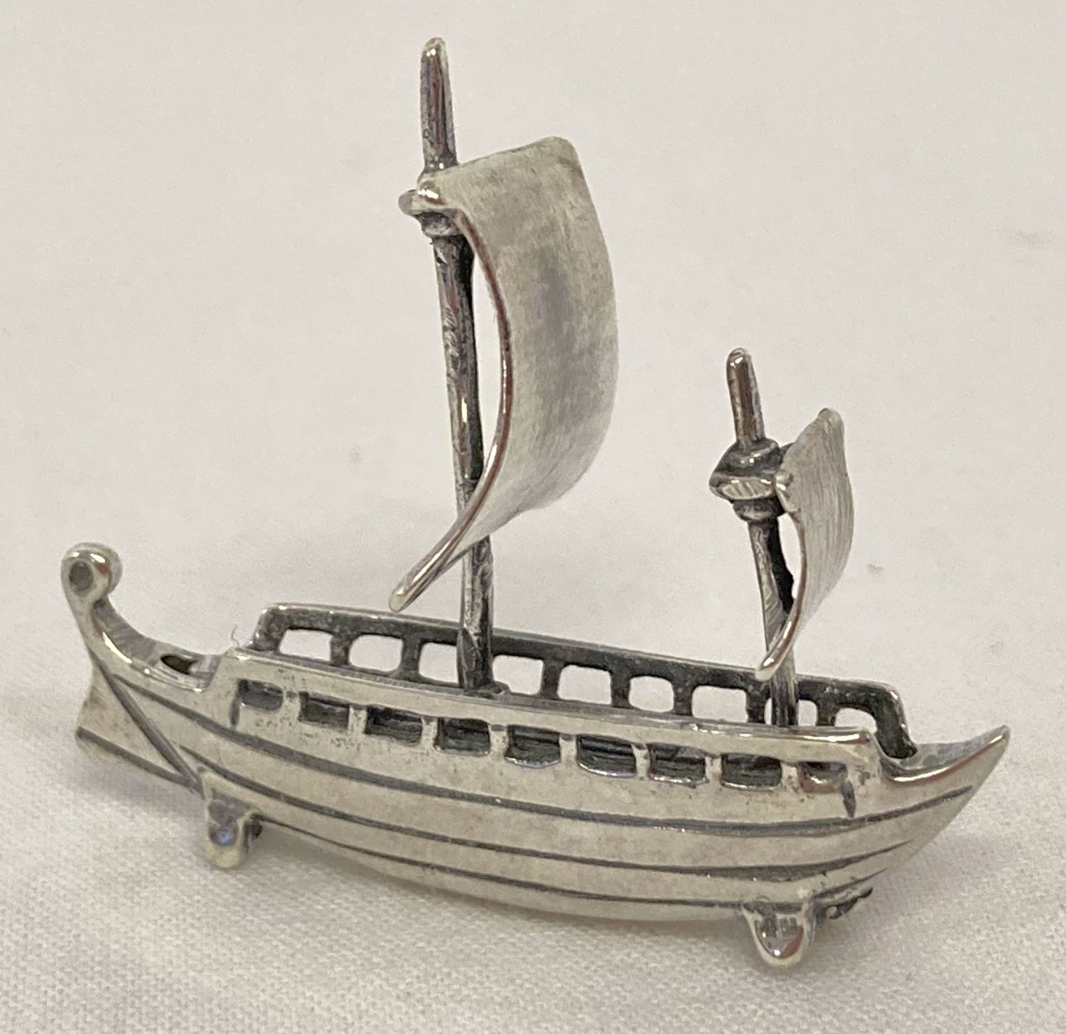 A miniature silver model of a sailing ship, marked 925.