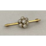 A 9ct gold and pearl flower design bar brooch.