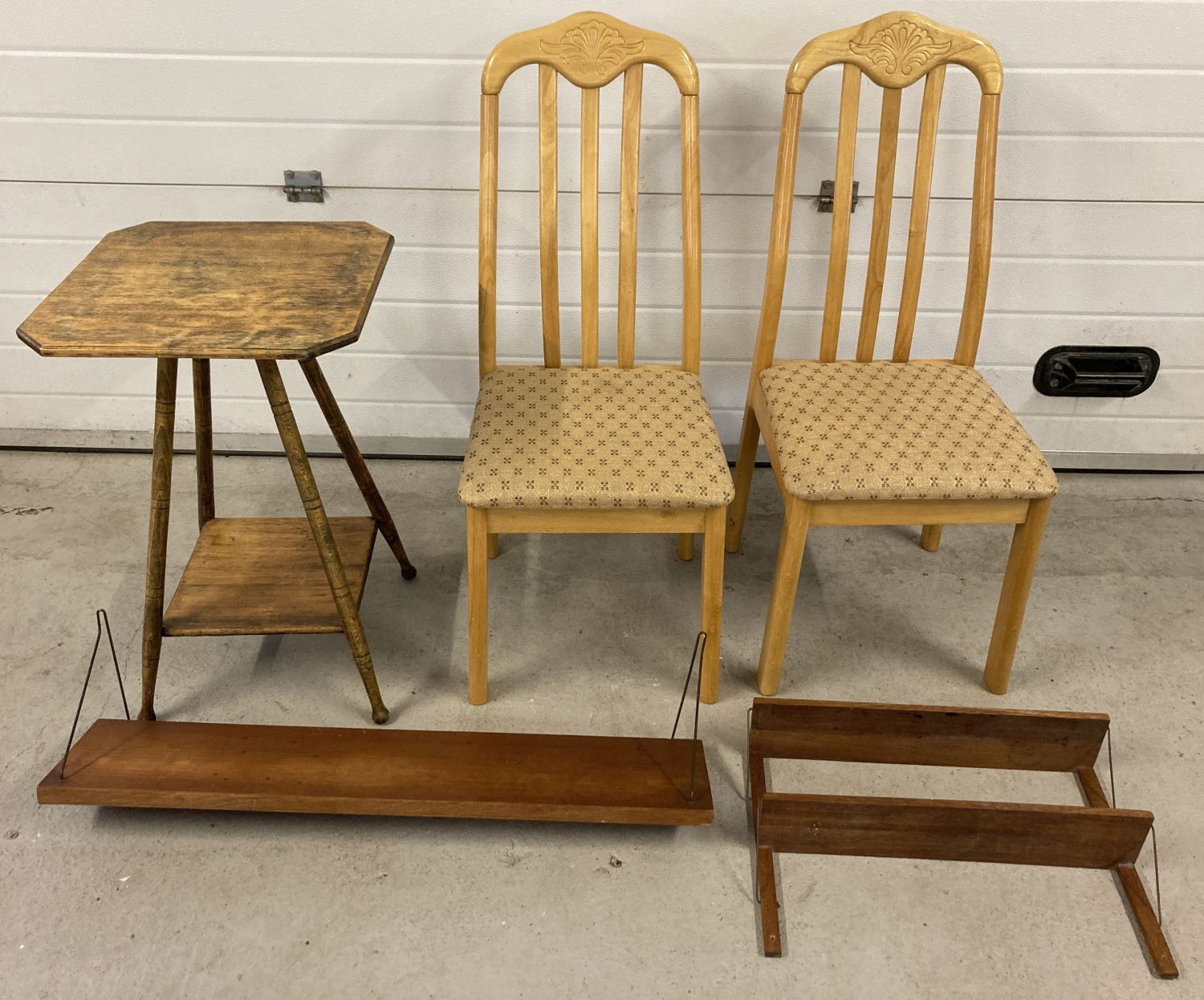 2 modern dinning chairs together with a vintage occasional table with 2 wall hanging shelves.