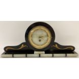 An Art Deco black slate and onyx mantle clock with gold scroll applique detail.