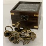 A replica wooden and glass lidded box containing a "Victorian Travelling Sextant" by Smith & Co.