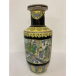 A large Chinese ceramic floor vase with figural panelled design and black and yellow ground.