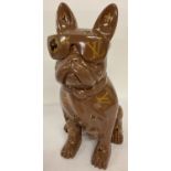 A large ornamental figure of a French Bulldog wearing sunglasses & with designer style motif decals