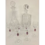 2 clear glass decanters together with a set of 6 stemmed liqueur glasses with purple & gilt detail.