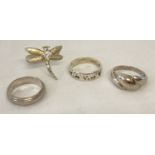 4 silver and white metal dress rings.