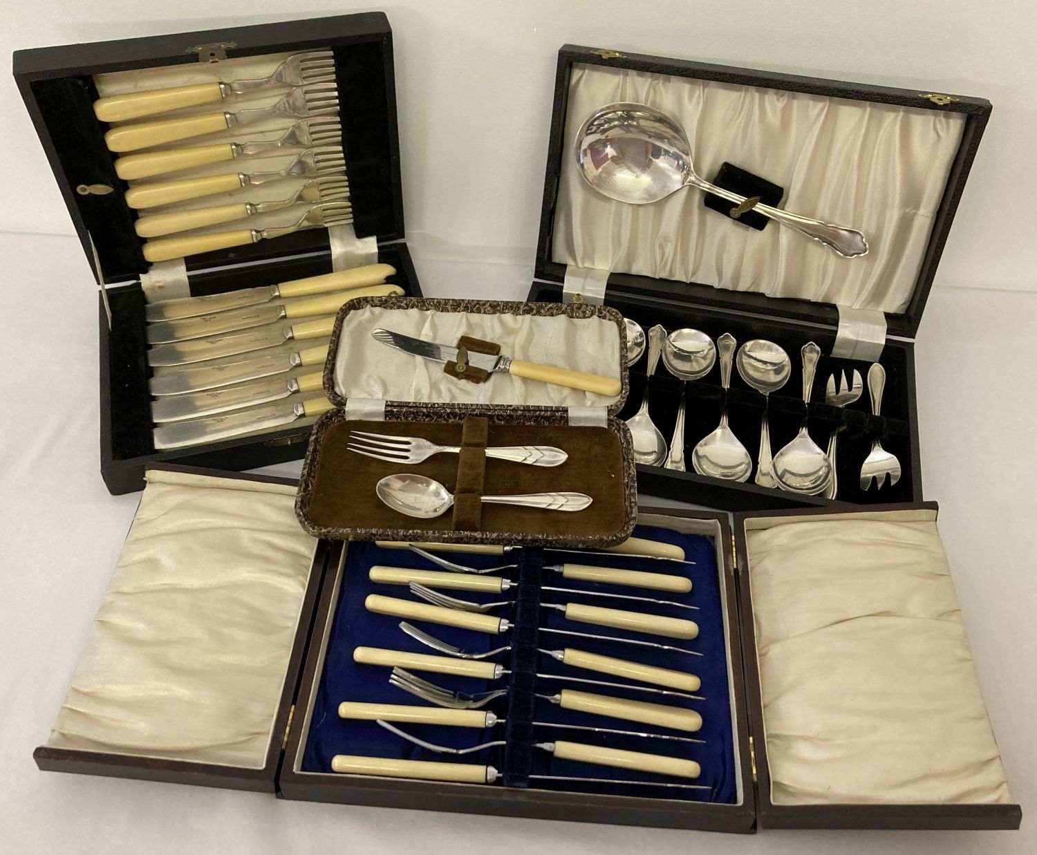 4 boxed silver plated and stainless steel cutlery sets.