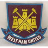 A painted cast iron West Ham United FC wall plaque, with fixing holes.