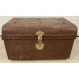 A Victorian tin trunk with original brass catch and lock.