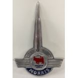 A shaped aluminium Morris Motors wall plaque with painted detail.