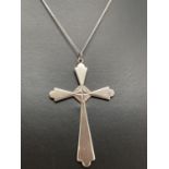 A large vintage silver cross pendant with engraved detail, on an 18" fine curb chain with spring