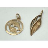 2 vintage 9ct gold charms/pendants. A leaf design with mounts for stones and a Pisces zodiac