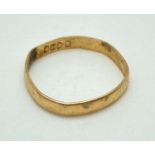 A 22ct gold 3mm wedding band. Needs reshaping. Ring size O. Approx. 1.6g.