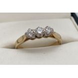 An 18ct gold .30ct diamond trilogy ring. Ring size N. Full hallmarks and makers mark to inside of