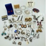 43 pairs of vintage and modern costume jewellery earrings. To include stone set and novelty. All