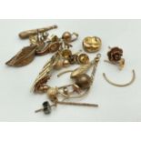 A small quantity of scrap gold jewellery to include earrings and a gold tooth. Total weight