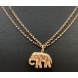 A 9ct gold pendant in the shape of an elephant, fully hallmarked. On 2 9ct gold 18" chains, a