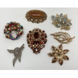 A collection of 7 vintage large statement brooches, all stone set. To include examples by Sphinx.