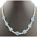 A 15" Kyanite, freshwater pearl and blue glass beaded necklace with silver T bar clasp. Retired