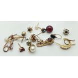 A small collection of odd scrap gold and stone set earrings. Marked or test as 9ct. Stones include