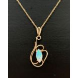 A 9ct gold wire style pendant set with a marquise cut opal. On an 18" rope chain marked 375 to