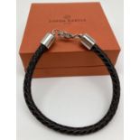 A brand new boxed brown plaited leather and stainless steel men's bracelet by Simon Carter. Approx