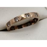 A vintage 9ct gold full eternity ring set with clear stones. Ring size K. Marked 9ct to inside of