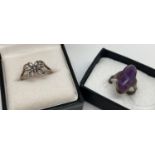 2 silver dress rings. A filigree style butterfly ring together with an oval cut amethyst cabochon